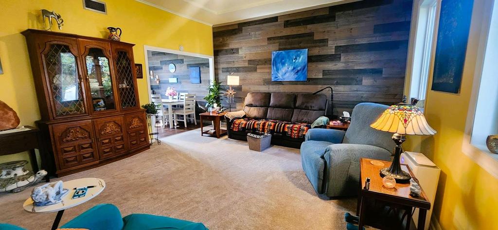 82 Willow Drive, Aspen Park &middot; living room with a wood feature wall