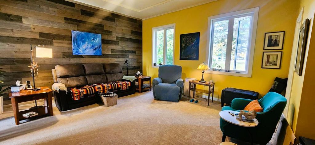 82 Willow Drive, Aspen Park &middot; living room with the feature wall and front windows