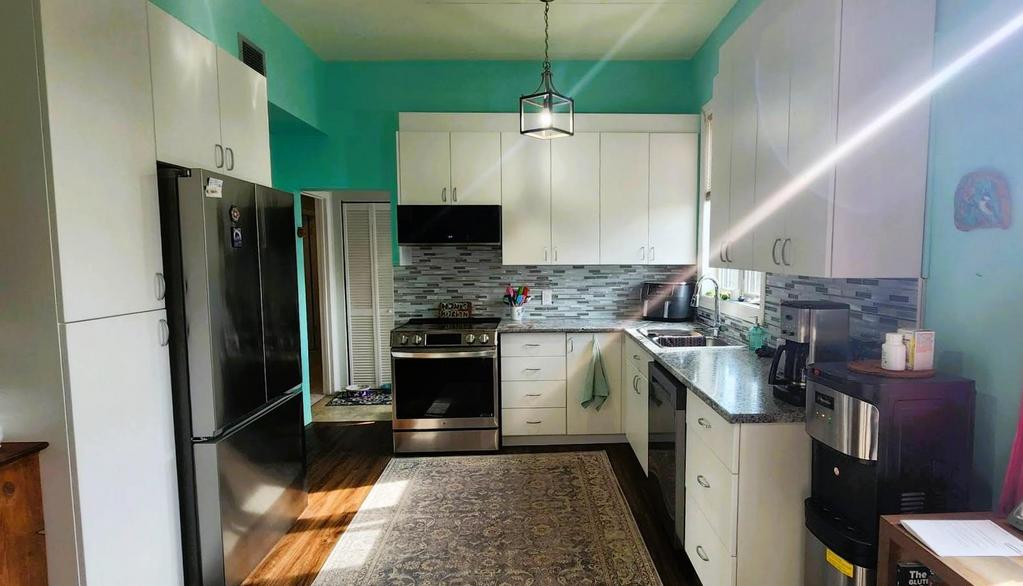 82 Willow Drive, Aspen Park &middot; kitchen with refrigerator, range and tiled backsplash