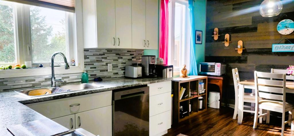 82 Willow Drive, Aspen Park &middot; kitchen sink and counter beside the dining area