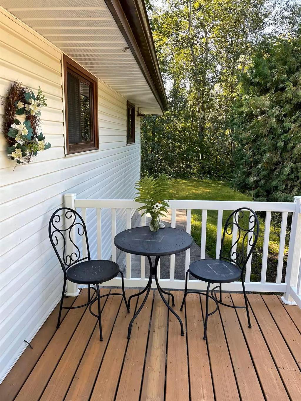 899 PTH 9 Highway, Winnipeg Beach &middot; side deck with a bistro table and chairs