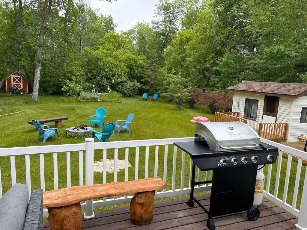 899 PTH 9 Highway, Winnipeg Beach &middot; view from the deck over the yard, the firepit and the storage shed