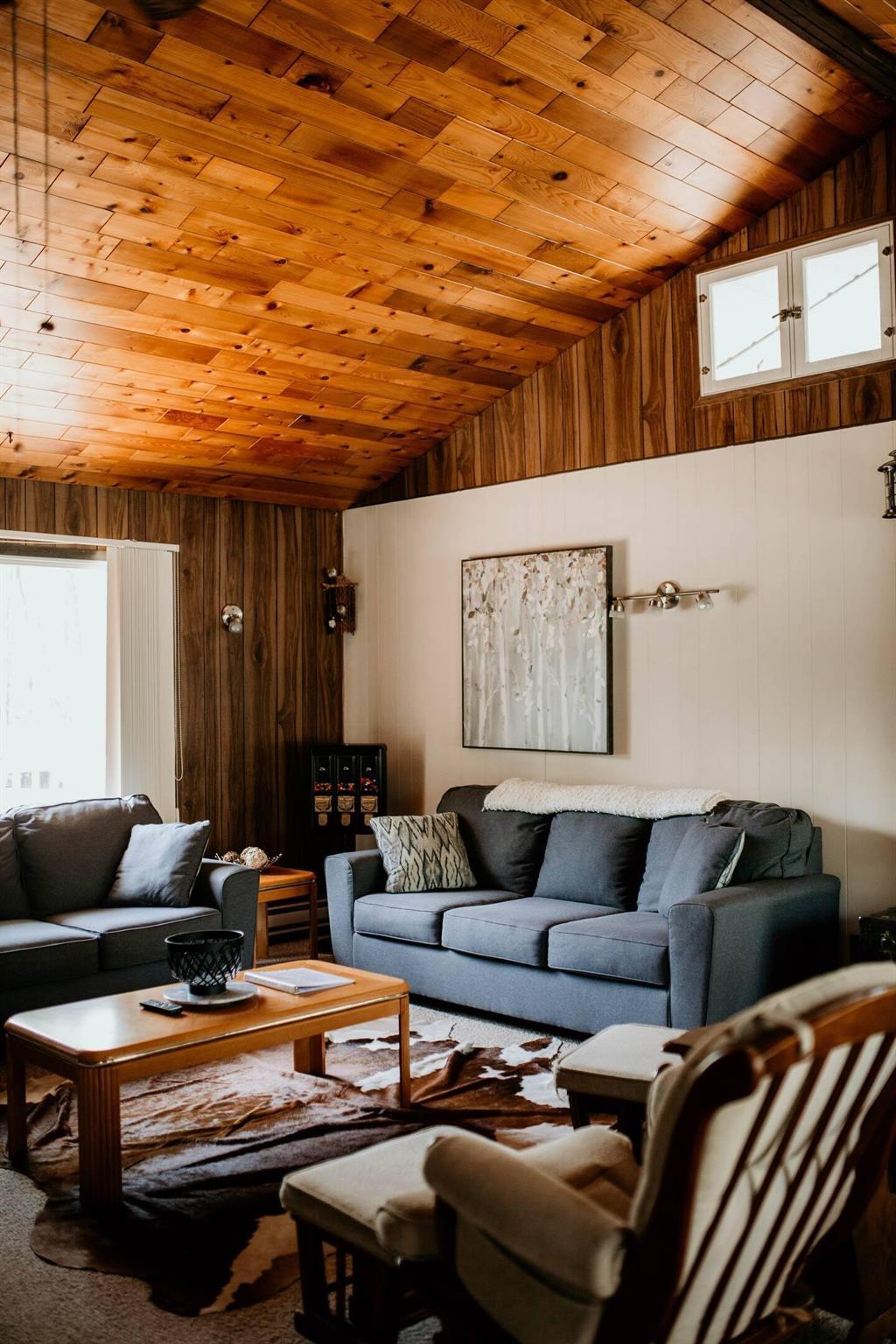 899 PTH 9 Highway, Winnipeg Beach &middot; living room under a wood-panelled vaulted ceiling