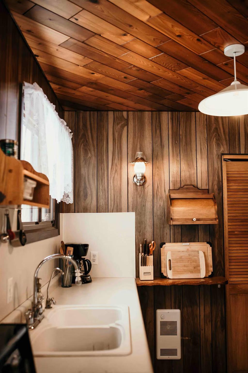 899 PTH 9 Highway, Winnipeg Beach &middot; kitchen sink and counter under the wood ceiling